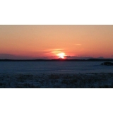 野付半島からの夕日　88km先の雄阿寒岳に夕日が沈む2月29日17:06